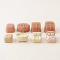 Cozy Companions silicone mousse cake molds displayed with finished furniture and pet mini mousse cakes.