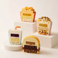 Cross section of Joyful Snackland mini mousse cakes showing the inner layers of the playful dessert designs.