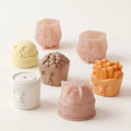 Mini mousse cake being released from the Joyful Snackland silicone mold during the demolding process.