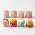 Joyful Snackland silicone molds displayed with finished mini mousse cakes in playful snack shapes.