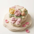 Finished Love Letter floral bouquet mousse cake with romantic rose, tulip, bow, and envelope details, made with a 3D silicone cake mold.