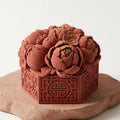 Side view of the peony mousse cake highlighting the intricate petals and hexagonal base.