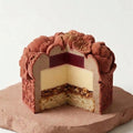 Internal view of the Oriental Peony cake displaying smooth mousse and ganache textures.