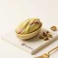 Realistic pistachio-shaped mousse cakes made with the Pure Pistachio 3D silicone mold set