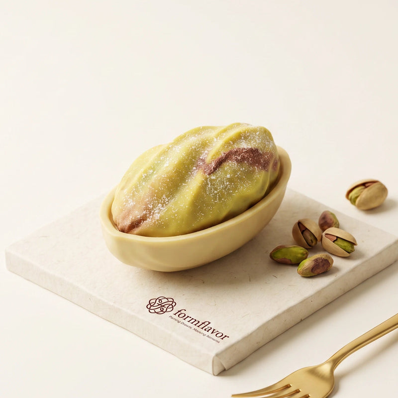Realistic pistachio-shaped mousse cakes made with the Pure Pistachio 3D silicone mold set