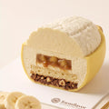 cross-section.webpCross section of the Sunny Banana mousse cake showing mousse, filling, cake and crunchy layers