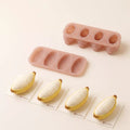 Sunny Banana silicone mold set displayed with finished banana-shaped mousse cakes