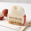 Sweet Lychee mousse cake cut open showing layered dessert structure and mousse texture